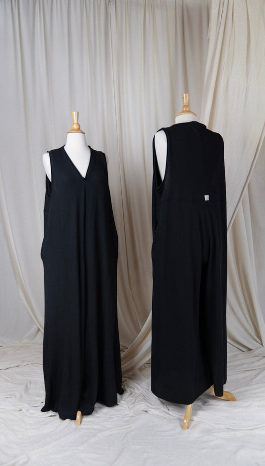 two black jumpsuits with v-necks and large arm holes