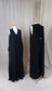 two black jumpsuits with v-necks and large arm holes 