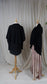 two black long sleeve cardigans styled with long light pink dress